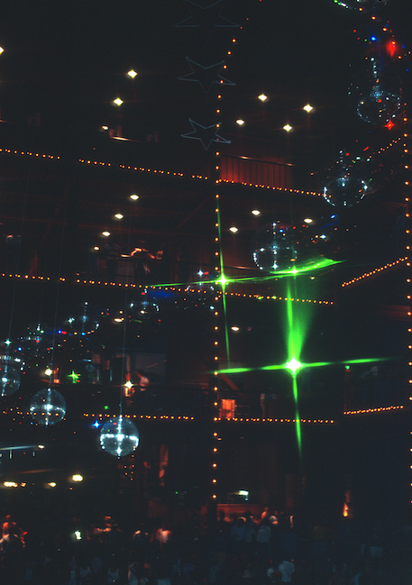 Image of lights and mirror balls from a ceiling in a discoteque